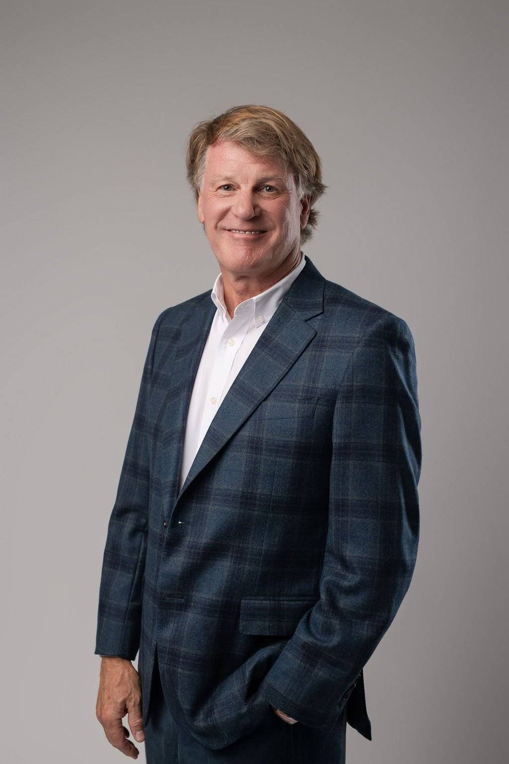 Dr. Paul E. Keck Jr., psychiatrist, smiling in a navy plaid blazer