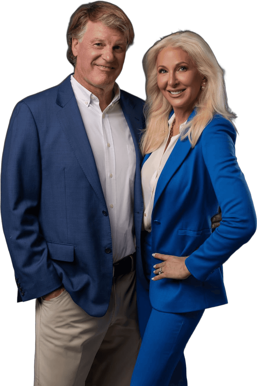 Dr. Paul Keck and Dr. Tracey Skale, smiling, in blue suits